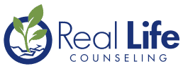 The Real Life Counseling Logo in blue lettering against a white background. 